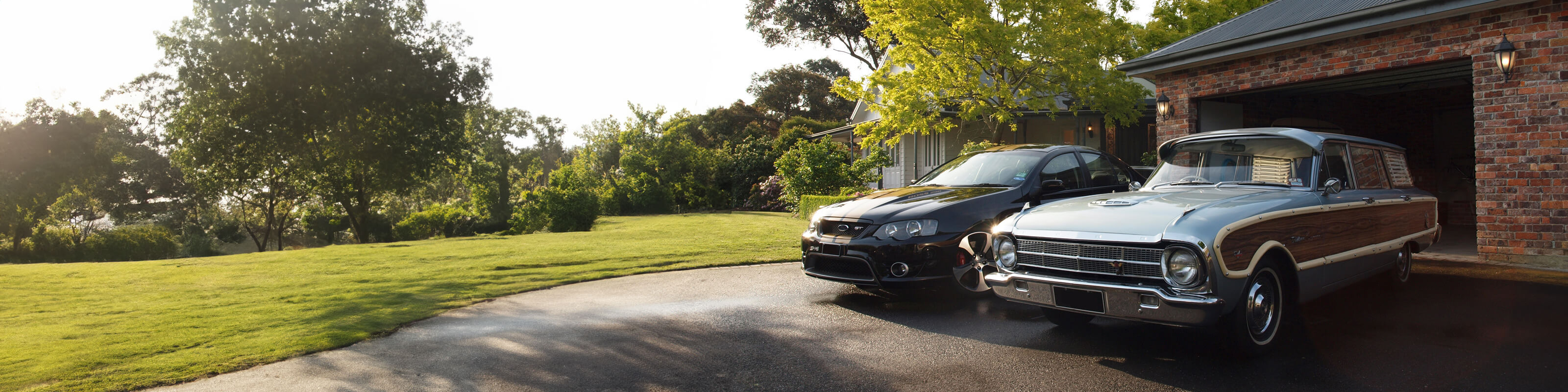 two cars in the driveway banner