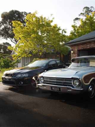 Two cars parked in the driveway